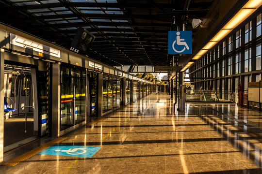 Golden hour sunlight reflecting on the polished floor of Morumbi Station on the new Line 17-Gold monorail transit system. n.