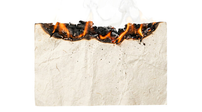 Burning old parchment paper sheet with blazing orange flames and rising white smoke on transparent background