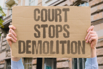 "Court stops demolition" Ruling halts building teardown. COURT. DEMOLITION. BULLDOZER. BUILDING. HERITAGE. © AndriiKoval