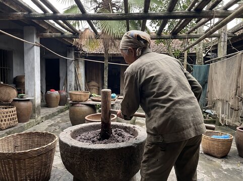 And old man making a shrimp paste 