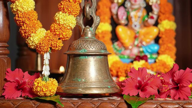 Brass Temple Bell with Marigold and Hibiscus for Hindu Puja Ritual