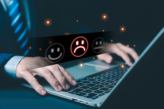 Laptop user experiencing negative feedback and customer dissatisfaction symbolized by sad rating icons and glowing alerts, representing poor service, bad reviews digital frustration and business risk.