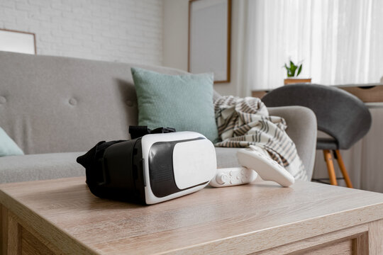 Virtual reality gaming and metaverse technology, vr headset with controller on a living room table for immersive digital entertainment and home leisure