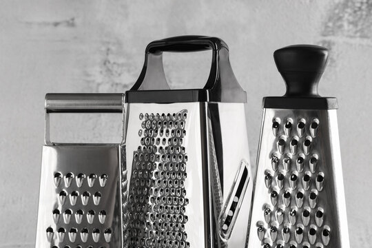 Food preparation and cooking tools, stainless steel kitchen graters for culinary tasks and meal ingredients in a professional restaurant or home kitchen