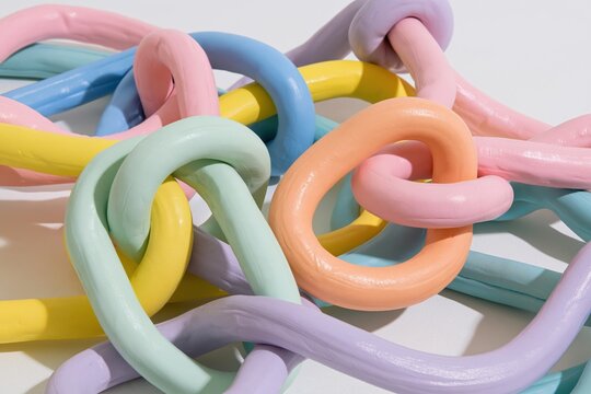 Pastel colored tubes tangled together