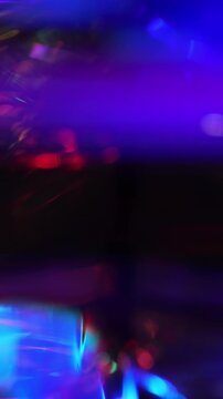 Christmas glowing background. Colorful motion abstract pink purple blue light
