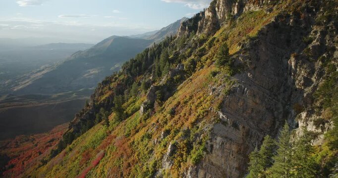 Beautiful Autumn Colors On Side Of Rocky Mountain Side At Sunset