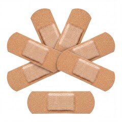 Obraz premium Collection of several brown flexible fabric adhesive bandages and medical plasters for wound care and first aid treatment, isolated on a white background, representing safety and healthcare supplies.