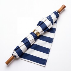 Obraz premium Classic Navy Blue and White Striped Folded Umbrella with Elegant Polished Wooden Handle and Gold Metallic Clasp Ring Isolated on White Background for Fashion and Travel Concepts