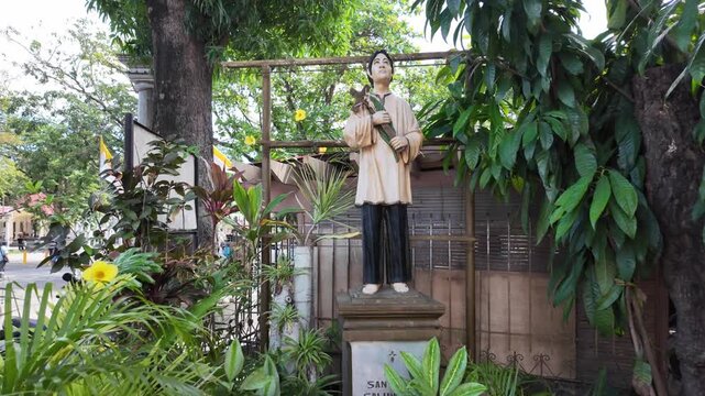 Statue of Saint Pedro Calungsod in a garden, Dumaguete, Philippines