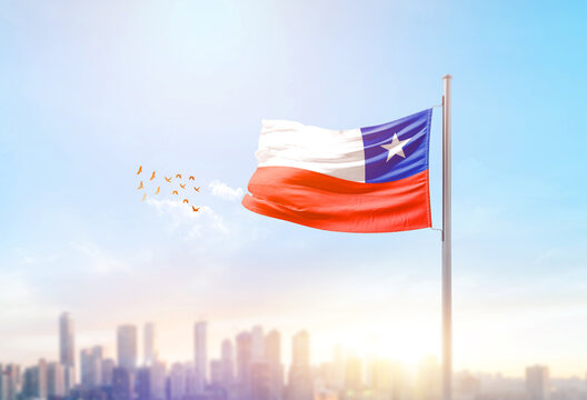 Chile national flag waving with skyline and buildings.