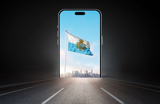 San Marino national flag on phone screen over highway to city. San Marino flag for Republic Day and Independence Day.