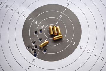 bullets on paper target for shooting practice © PRASERT