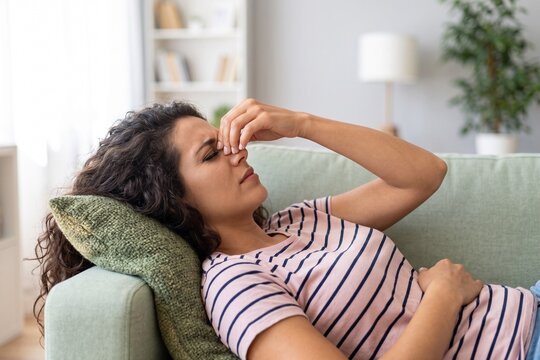 Young Woman Severe Migraine and Sinus Headache Pain