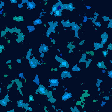 Abstract blue and teal blotches create a speckled pattern on a dark background