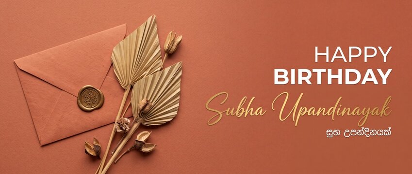 Happy birthday Sinhala greeting card with envelope, wax seal, and dried palm leaves on terracotta background for Subha Upandinayak celebration, Sri Lankan culture, elegant boho aesthetic template.