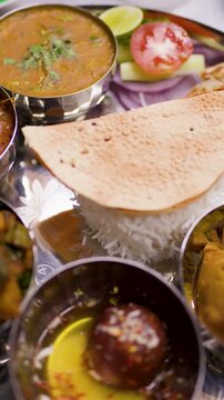 Top View of Traditional Indian Thali Platter With Curry and Rice