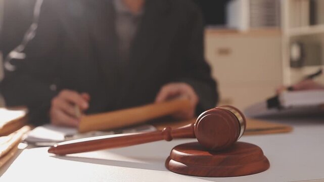 Consultation and conference of professional businesswoman and Male lawyers working and discussion having at law firm in office. Concepts of law, Judge gavel with scales of justice