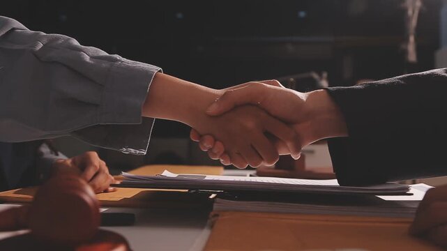 Consultation and conference of professional businesswoman and Male lawyers working and discussion having at law firm in office. Concepts of law, Judge gavel with scales of justice