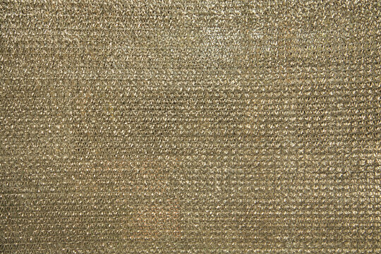 Golden brown plastic paranet shade net texture and background