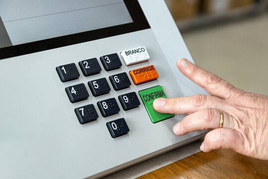 Close-up of a voter voting on electronic voting machine ahead of Brazilian elections