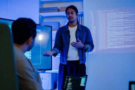 software engineers team developing autonomous AI agents and agentic terminal coding in a cowork environment.Concept of constitutional AI,agentic coding,large language models and reinventing software.