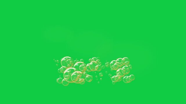 Floating soap bubbles rising up against green screen background in dynamic motion for visual effect footage