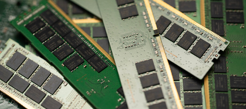 RAM computer memory DDR module hardware. RAM DRAM chip electronics circuit board. RAM PC motherboard slot system upgrade. RAM computing technology processor performance.