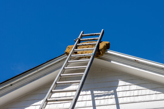 Ladder leaning against roof
