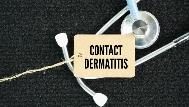 Stethoscope and paper tag with the words Contact dermatitis is an itchy, inflammatory skin rash caused by direct contact with an irritating substance or an allergen.
