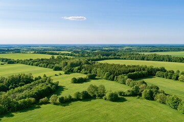 Obraz premium The Aerial Landscape of Lush Green Farmlands and Rolling Hills