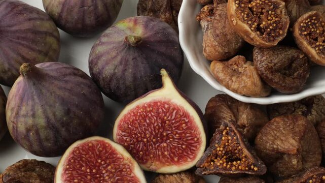 Fresh and dried figs assortment on a white background