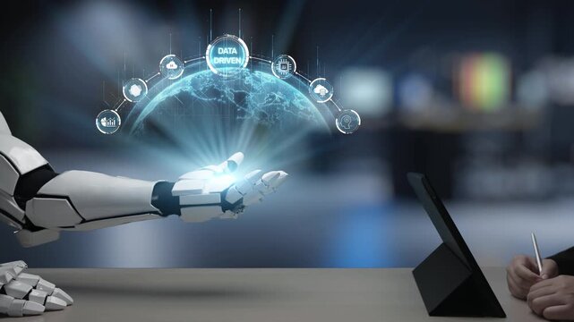 A human hand and a robotic arm reach toward each other, showcasing a futuristic interaction with digital data visualization in a sleek, modern setting. Salient