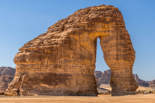 Elephant Rock, or Jabal AlFil, rises from the golden desert sands of AlUla, Saudi Arabia, as an iconic natural sandstone landmark.
