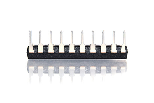 Integrated circuit pins reflecting on white surface