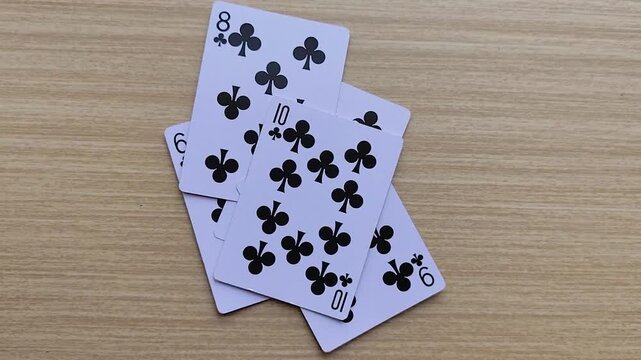 Dealing cards at the table, revealing the poker playing cards.