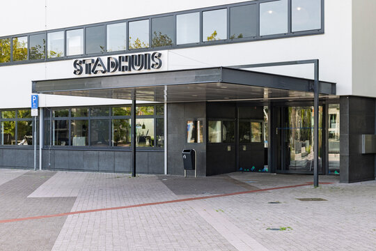 Purmerend, Netherlands - Exterior view of the main entrance of the Stadhuis (City Hall) in Purmerend, featuring modern architecture, glass doors, and a canopy.