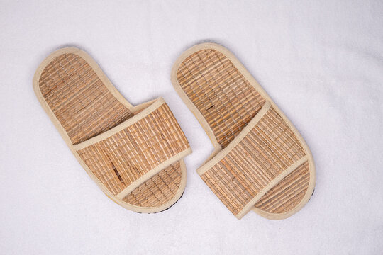 Spa slippers performing relaxation in a wellness setting with natural