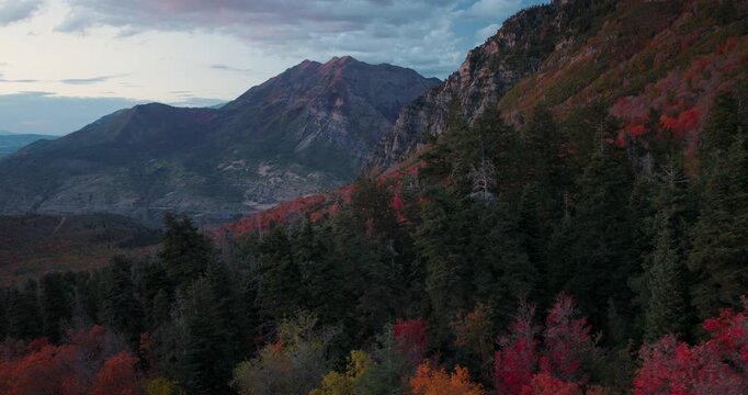 Smooth Aerial Shot Moving Down Autumn Rocky Mountain Side At Dusk