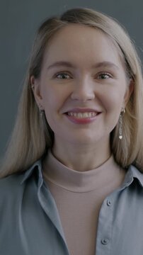 Slow motion portrait of excited young lady looking at camera enjoying good surprise on black studio background. People and positive emotion concept.