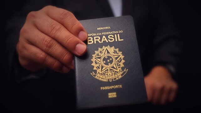 Brazilian Passport Held In Hand Close Up