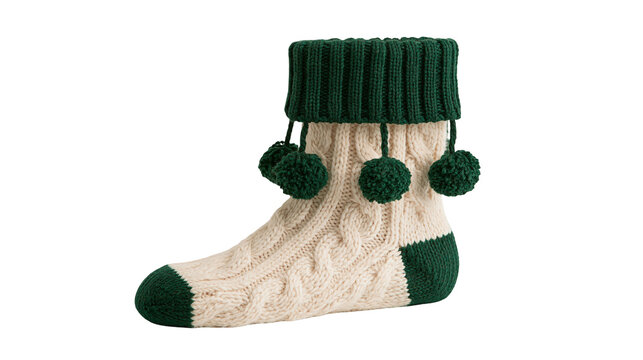 Cream cable knit wool sock with dark green cuff and hanging pom pom decorations