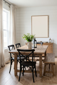 Scandinavian dining room with wooden table and black chairs