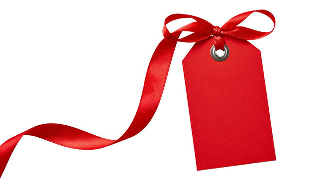 Red paper gift tag with a shiny satin ribbon bow and metal eyelet