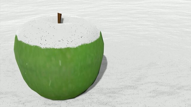 Green apple covered in snow on a white background