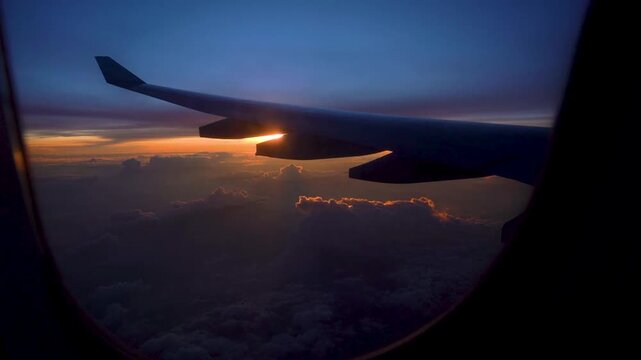 A Captivating Journey Through the Skies: Majestic Sunsets Seen from an Airplane Window with a Wing Silhouette