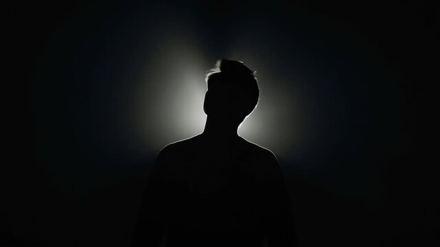 Silhouette Portrait Backlight with Halo Effect, Dramatic Mysterious Male Profile Mood