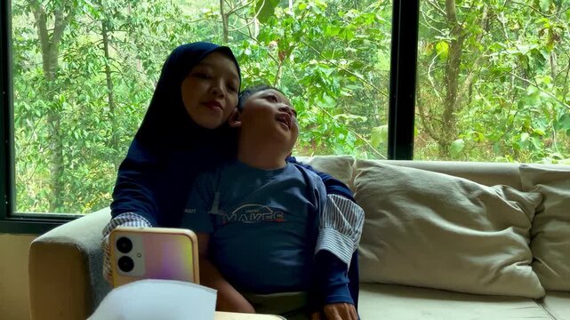 A mother gently embracing her child with special needs in a bright, sunlit living room, highlighting a moment of deep family connection and nurturing care.
