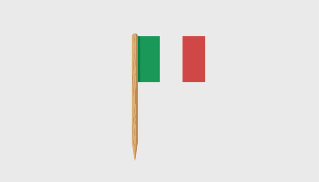 Small Italian flag toothpick on a light grey background represents national identity, culinary tradition, or party accessory.