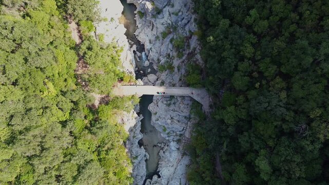 Drone descends above Dala Bridge over Acheron River in Greece